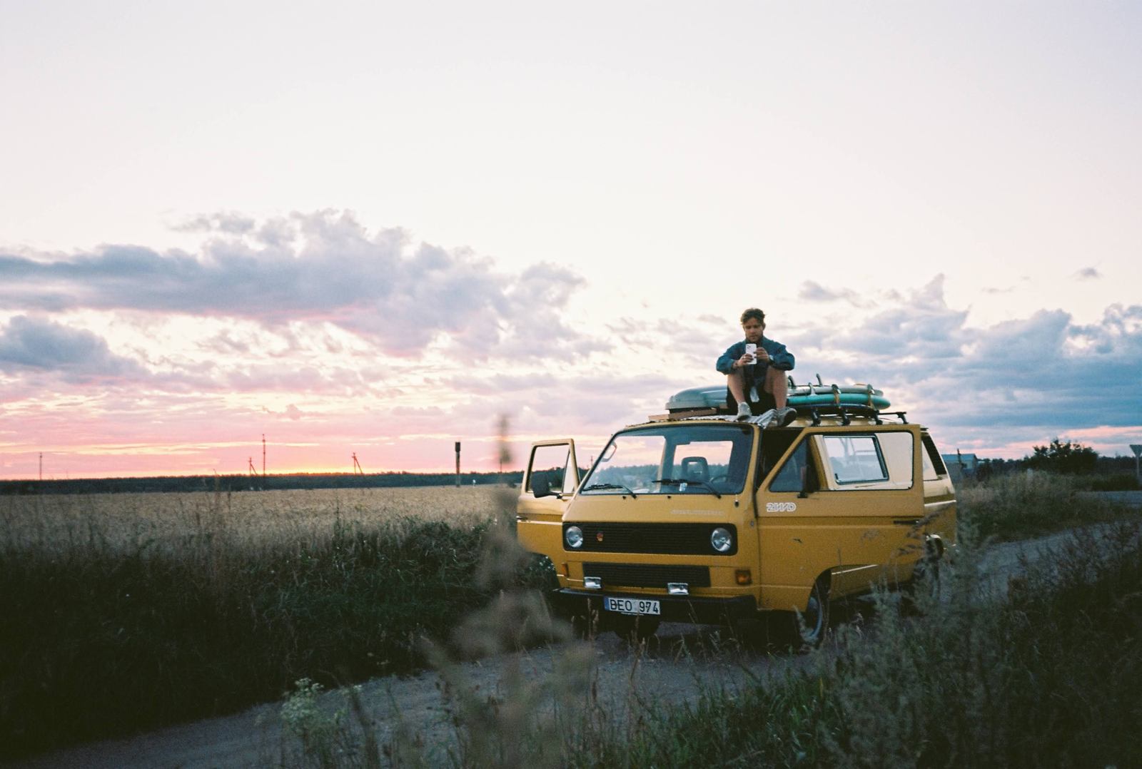 Bitutė on a dirt road, doors open — shot on film